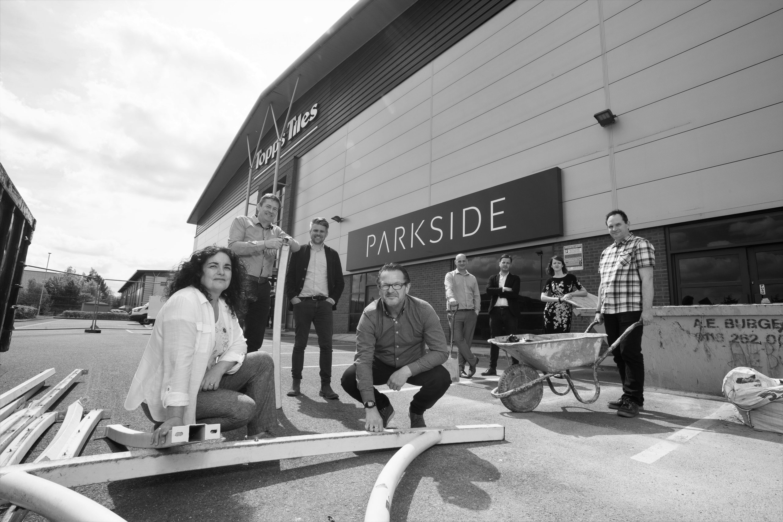 Copyright 2018 Mike Sewell (tel: 07966417114) Photograph by Mikey Sewell. Topps Tiles Parkside team outside their new building on Grove Park in Leicester  (Commissioned by Lizz Lee)